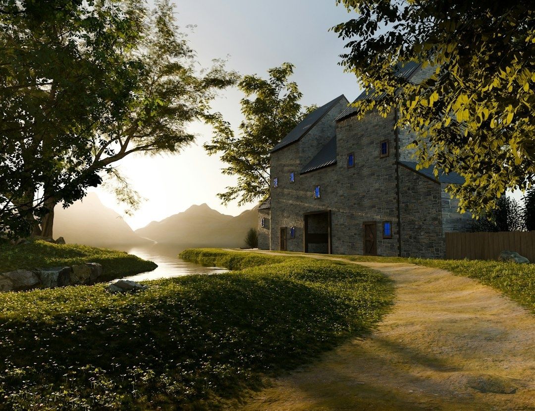 Sunlit 3D-rendered stone building beside a reflective stream